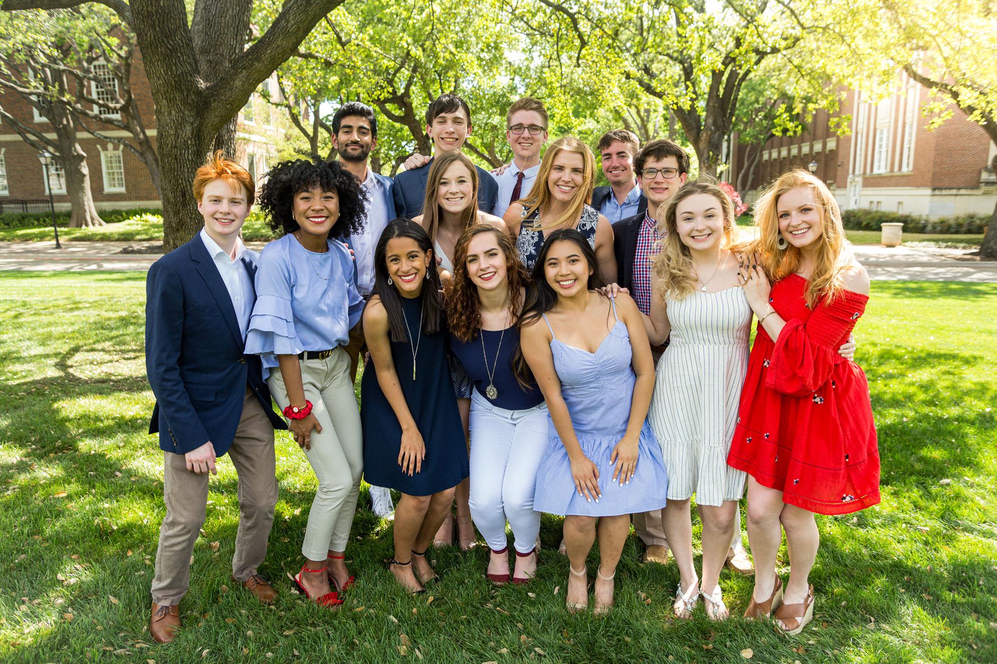 14 orientation leaders posing on Dallas Hall lawn